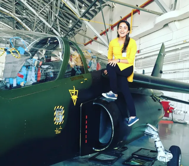 raheja posing on a jet