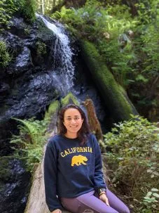 Garima Raheja in front of a waterfall