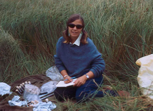 linda heusser sitting in grass